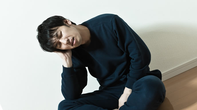 割りに合わない仕事で悩む男性