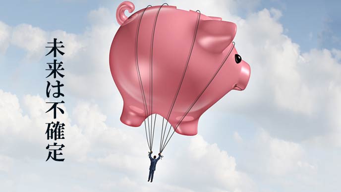 貯金の風船にぶら下がって飛んでいく男性